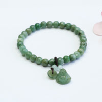 Bracelet d'équilibrage en jade cyan Bouddha rieur de KarmaRipple 