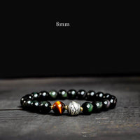 Bracelet de protection en obsidienne arc-en-ciel et or brillant de KarmaRipple pour vivre un retournement de fortune