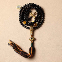 Bracelet de protection Bagua tibétain à 108 perles en onyx noir et œil de tigre de KarmaRipple