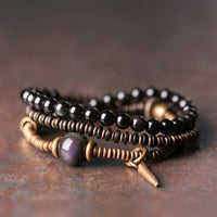 Bracelet triple tour équilibré en bronze, bois d'ébène et obsidienne arc-en-ciel de KarmaRipple