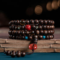 Bracelet de force en jade et agate rouge avec boucle de paix en bois d'agar de Kalimantan et Bouddha rieur de KarmaRipple, 108 perles Mala