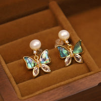 Boucles d'oreilles papillon en bronze plaqué or 18 carats et perles de coquillage authentiques de KarmaRipple