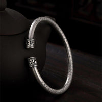 Bracelet porte-bonheur en bronze ivoire avec le Sutra du cœur tibétain de KarmaRipple