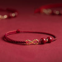 Bracelet de cheville symbole infini en or 14 carats avec cordon rouge et bénédiction cinabre de KarmaRipple