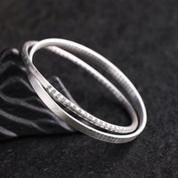 Bracelet de protection en argent sterling 999 sculpté avec le Sutra du cœur de KarmaRipple