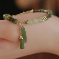Bracelet d'abondance en jade et feuille de bambou, motif muguet, de KarmaRipple