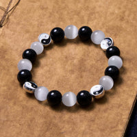 Bracelet de force purificatrice Yin Yang en obsidienne noire œil de chat de KarmaRipple