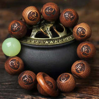 Bracelet de protection du tigre gravé en bois de rose tibétain de KarmaRipple