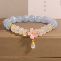 Bracelet d'équilibrage en perles d'agate ivoire et aigue-marine de KarmaRipple, perles de boulier et fleurs