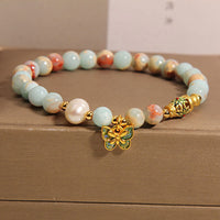 Bracelet de richesse papillon en perles de pierre Shoushan de KarmaRipple