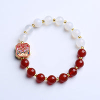 Bracelet d'équilibrage de force en agate rouge et ivoire de KarmaRipple