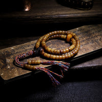 Bracelet d'équilibre en ambre et os de yak tibétain 108 Mala de KarmaRipple