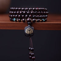 Bracelet d'équilibre en perles de 108 Malas tibétains à petites feuilles, en bois de santal rouge et lotus de KarmaRipple