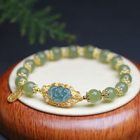 Bracelet porte-bonheur en argent sterling 925 plaqué or 14 carats et jade Hetian de KarmaRipple