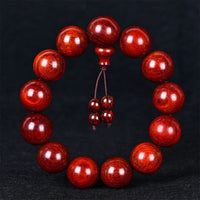Bracelet d'équilibre tibétain en bois de santal rouge à petites feuilles de KarmaRipple