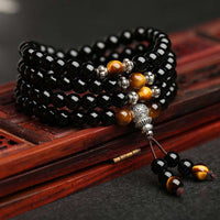 Bracelet Mala en obsidienne noire œil de tigre de KarmaRipple