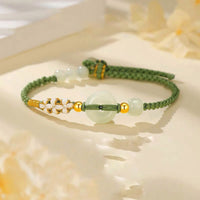 Bracelet tissé en jade Hetian avec boucle de paix et fleur de pêcher de KarmaRipple