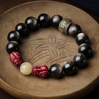 Bracelet de protection Om Mani Padme Hum en obsidienne dorée et cinabre PiXiu de KarmaRipple