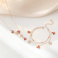 Ensemble collier et bracelet en argent sterling 925 avec pendentif en forme de trèfle à quatre feuilles et papillon en agate rouge Tridacna de KarmaRipple