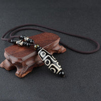 Pendentif de protection de richesse en perle Dzi à neuf yeux de KarmaRipple