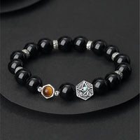 Bracelet de purification en argent sterling 925 et obsidienne noire œil de tigre de KarmaRipple