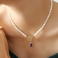 Collier pendentif talisman de richesse en zircon et perle de KarmaRipple