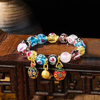 Bracelet de perles de verre Liuli fluorescentes lumineuses en forme de cœur rose avec motif de la famille des bêtes avaleuses d'or de KarmaRipple