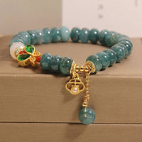 Bracelet d'abondance en perles de jade, ivoire, agate et papillon de KarmaRipple
