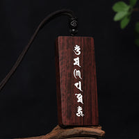 Collier avec pendentif de protection incrusté de petites feuilles en argent sterling 999 de KarmaRipple en bois de santal rouge et ébène Om Mani Padme Hum