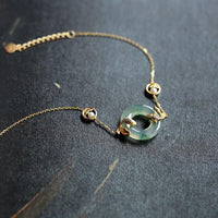 Bracelet d'équilibre en jade cyan avec poisson koï de KarmaRipple 